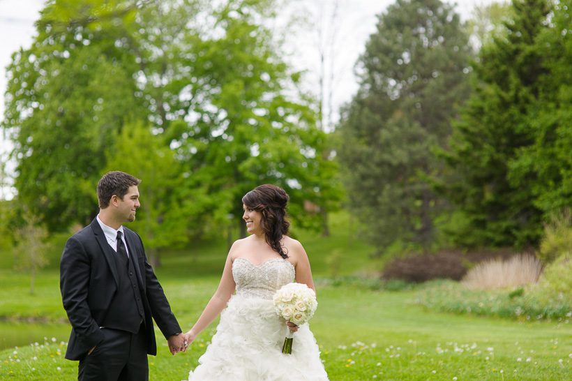 Bride and groom holding hands