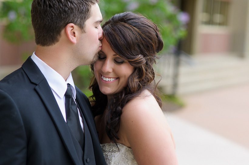 Groom kissing bride