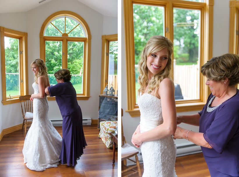 Bride putting on dress