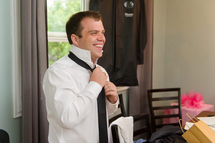 Groomsman getting dressed