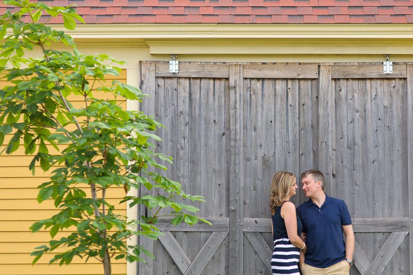 Couple engagement session with yellow barn