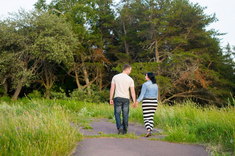 Couple walking in Moncton field
