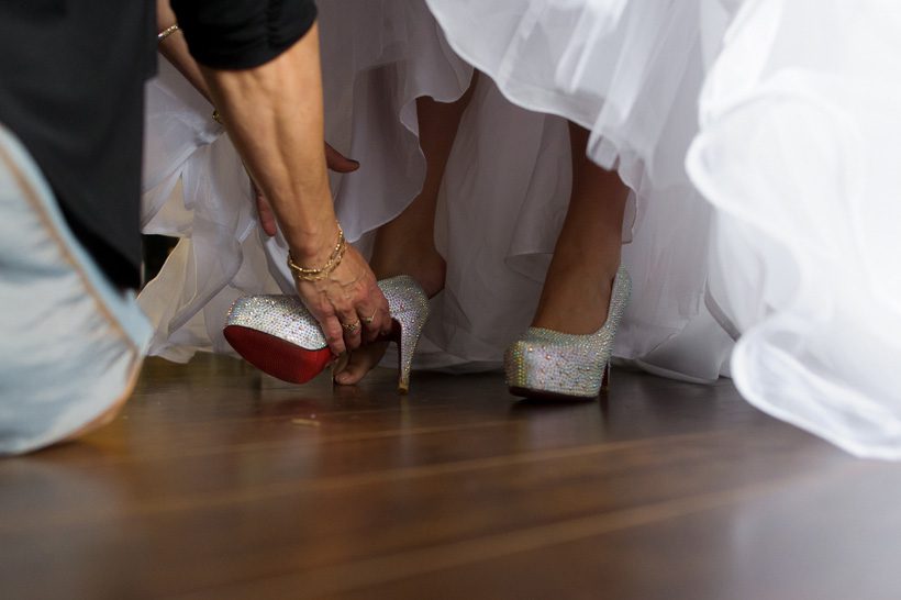 Bride putting on shoes