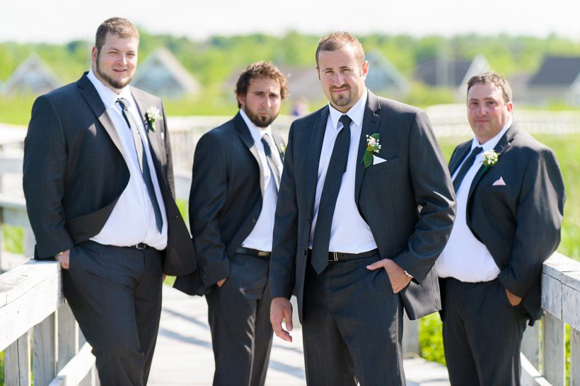 groomsmen on wood patway