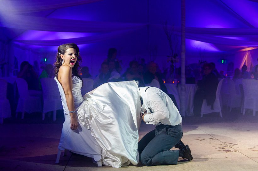 Groom removing garter
