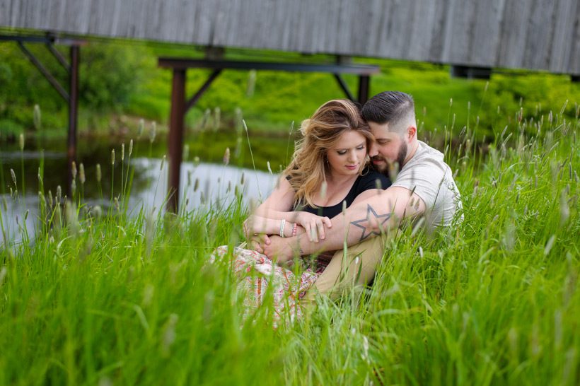 Couple laying down in field