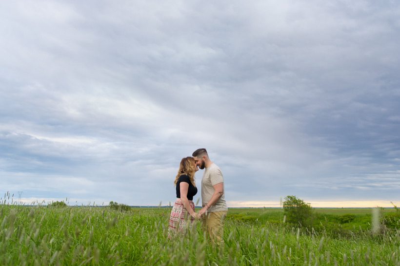 Couple kissing in field