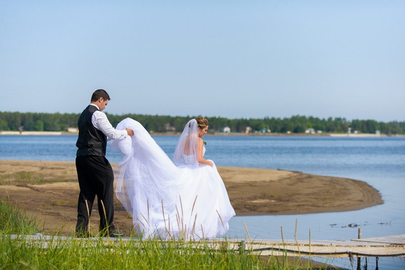 Bride and groom on dock