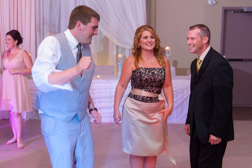 groom dancing with mother
