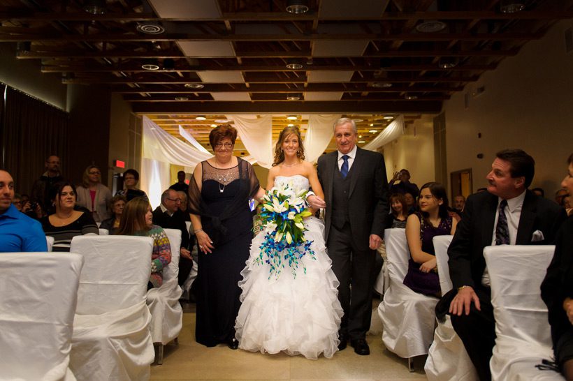bride walking with parents