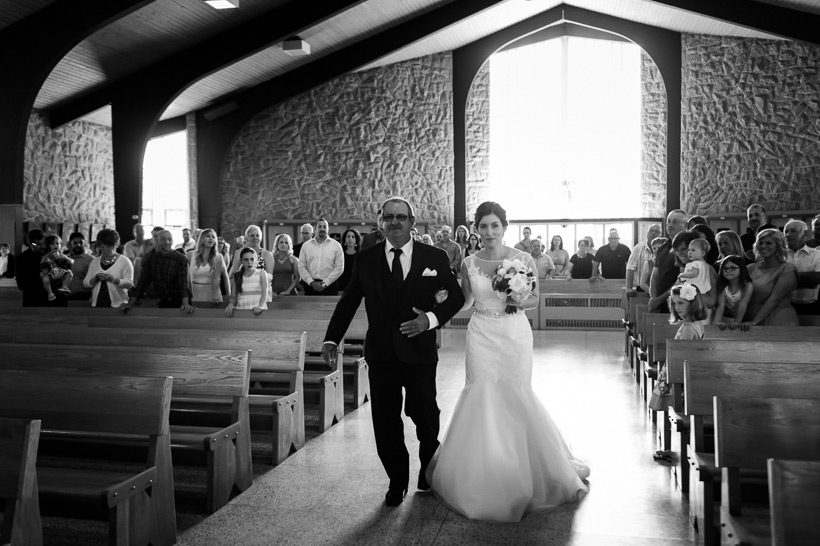 Bride walking down aisle in Cap Pele