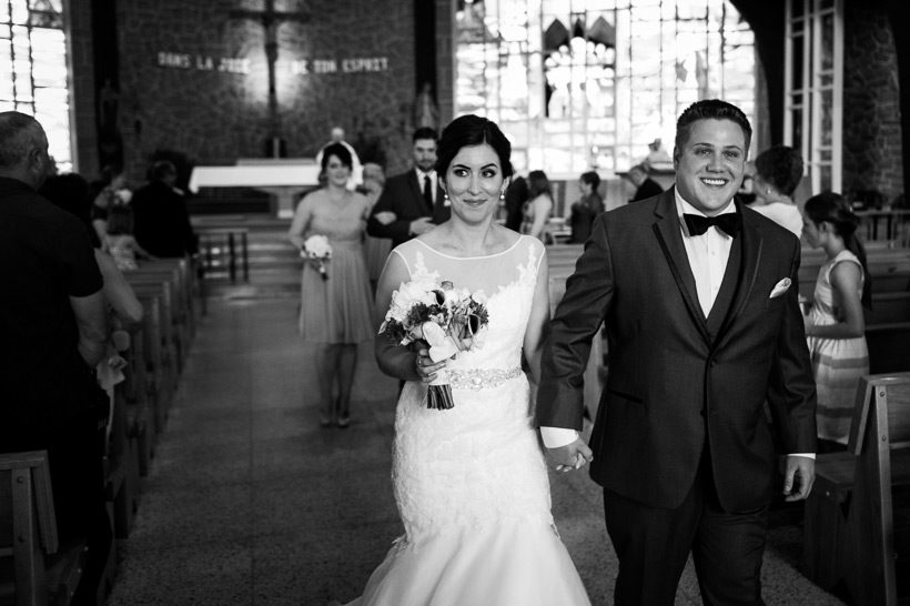 Wedding couple walking out of church