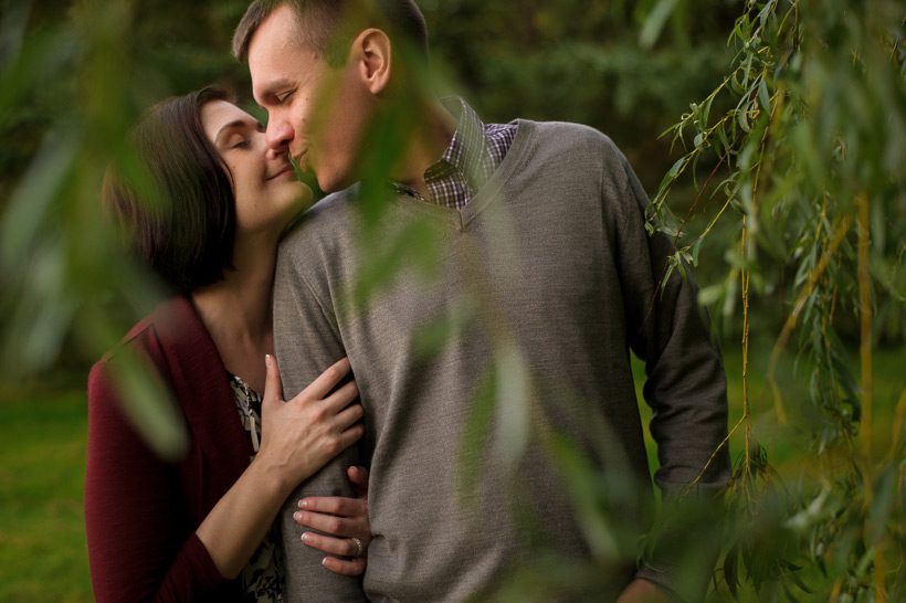Couple kissing on engagement shoot