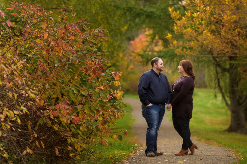 Couple holding hands at local park