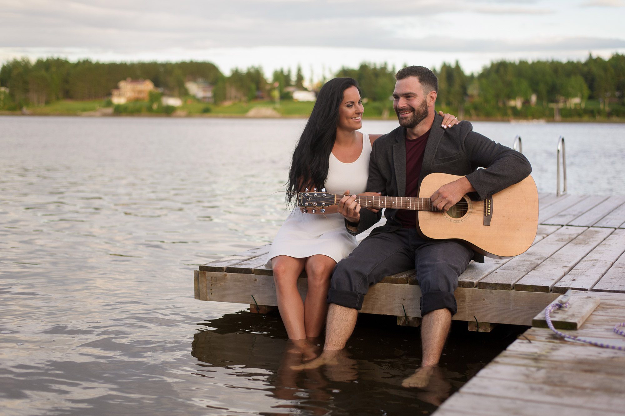 Couple sitting on dock - Cocagne NB