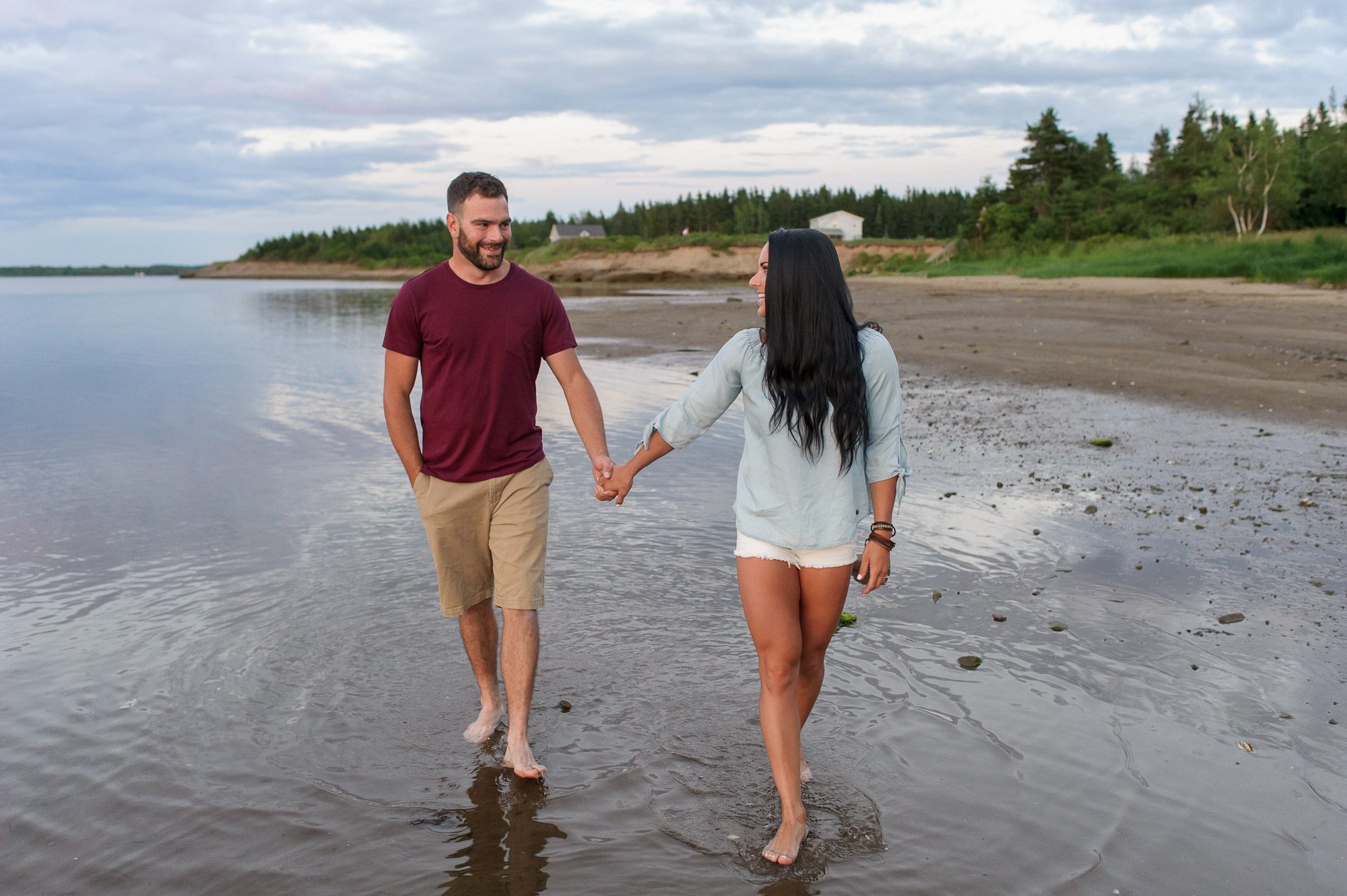 Couple walking in water - Cocagne, NB