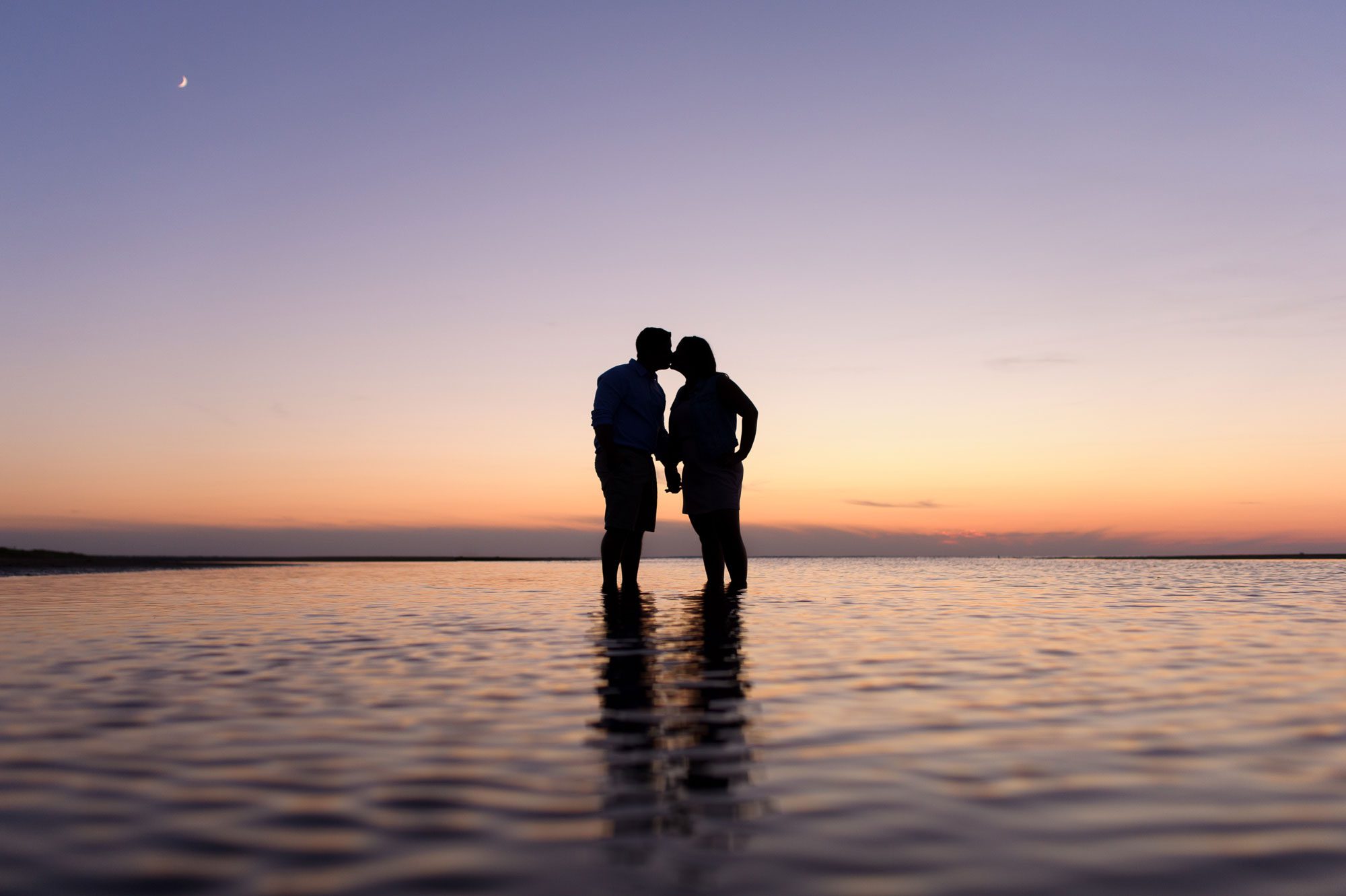 Pink and purple sunset beach engagement