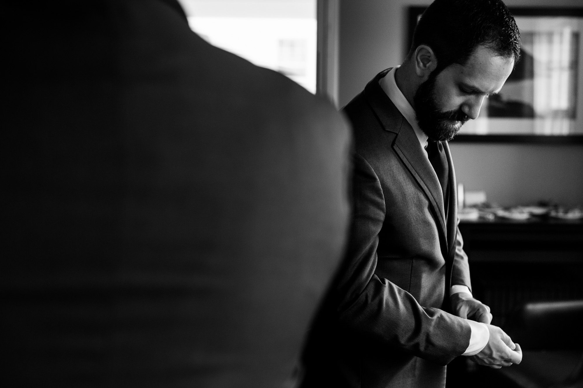 Groom getting dressed