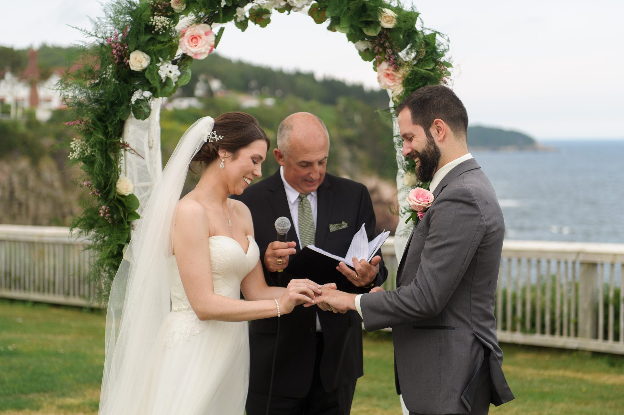 Bride putting on wedding ring