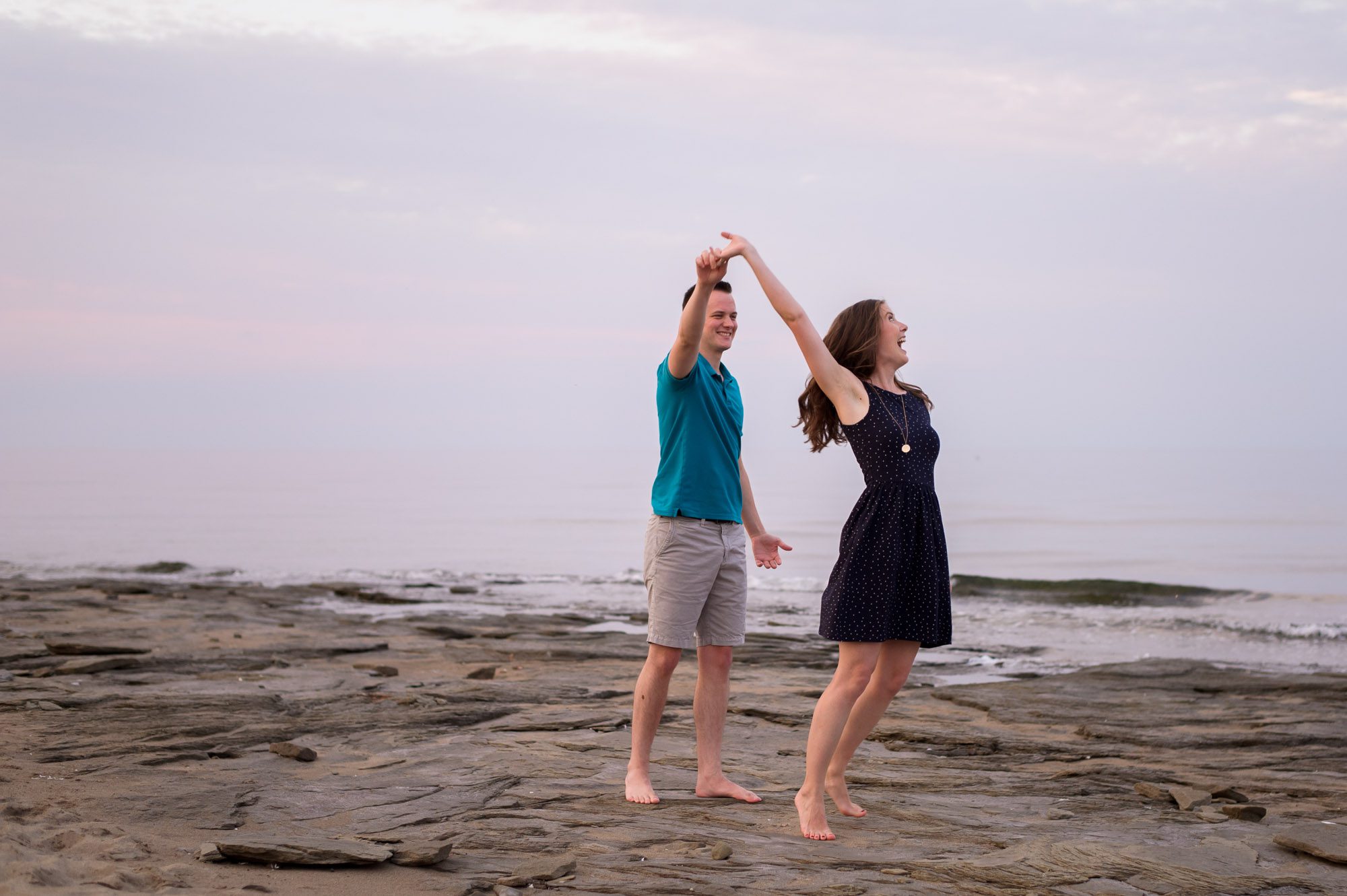 Beach engagement at sunset