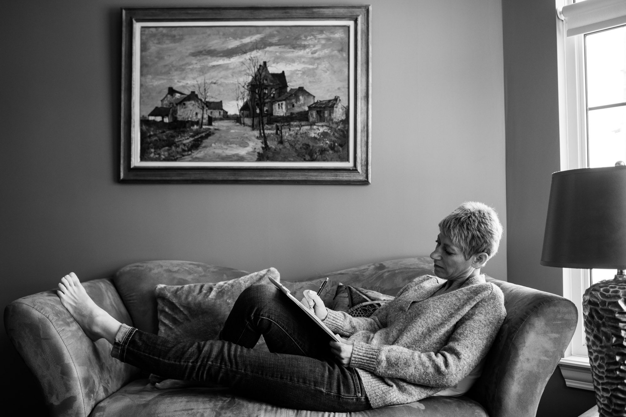 Moncton artist sketching by the window