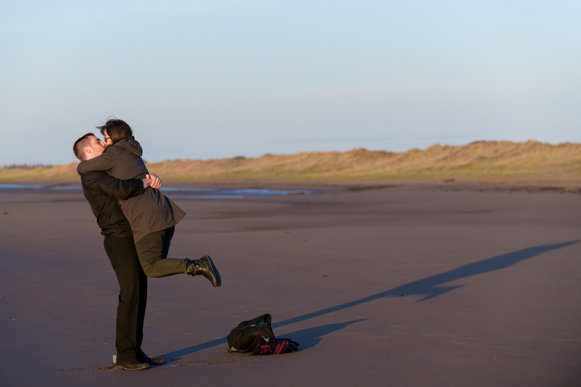 Recently engaged couple at the beach