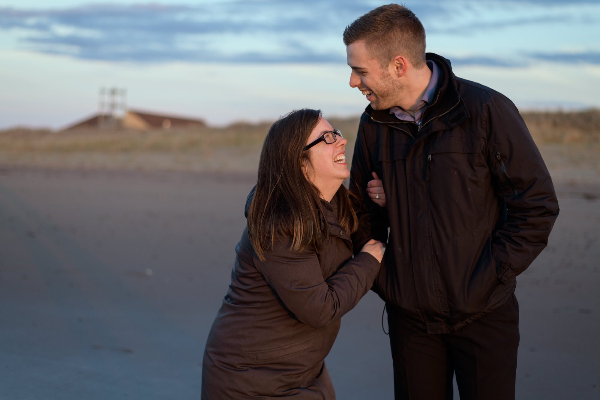 Couple laughing at the beach