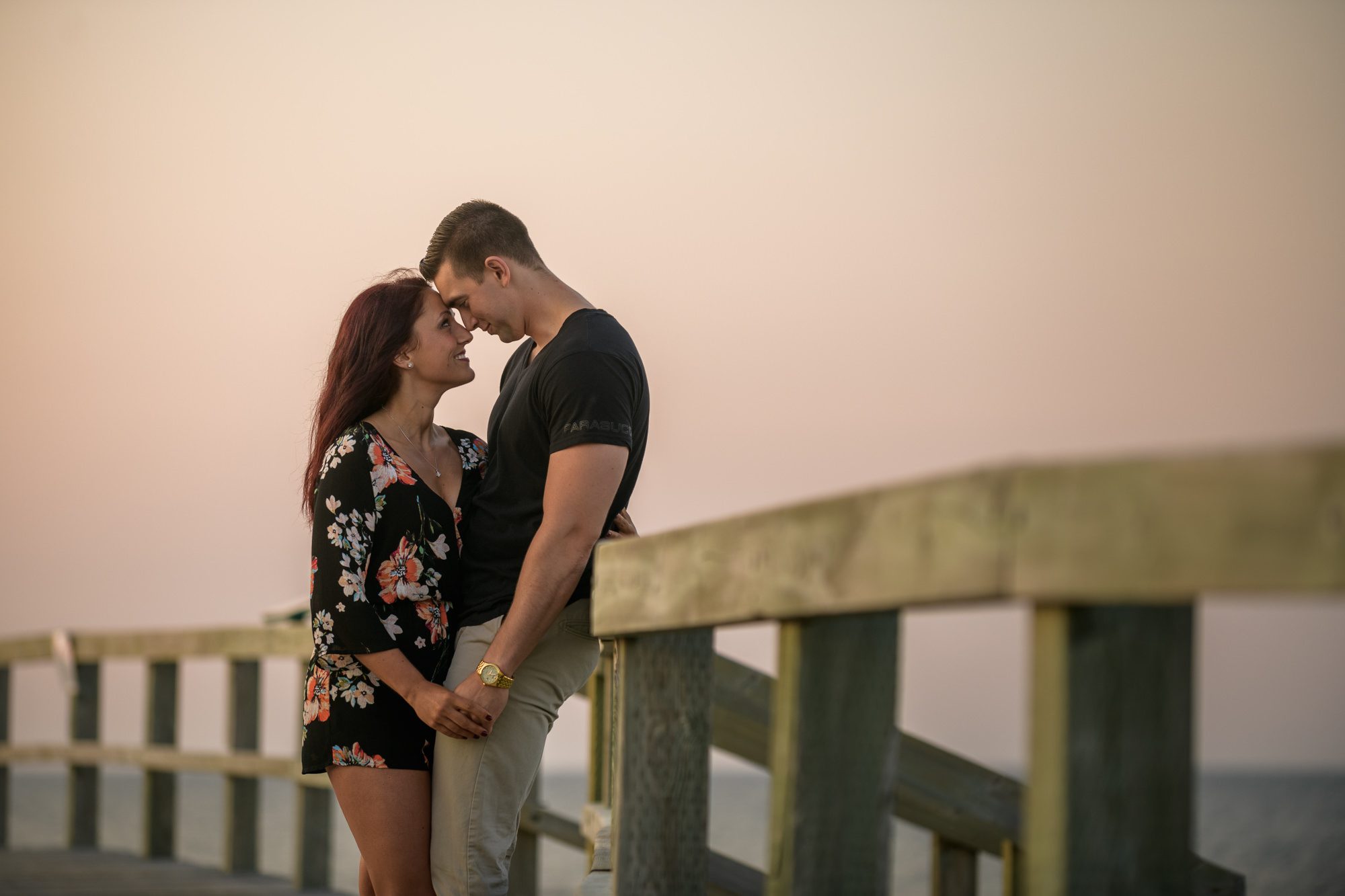 Boardwalk engagement at sunset
