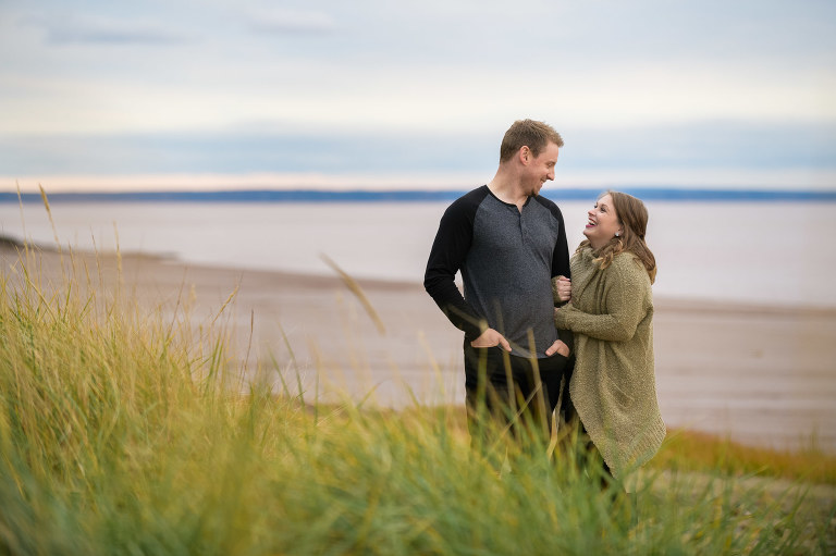 Couple laughing on the beach